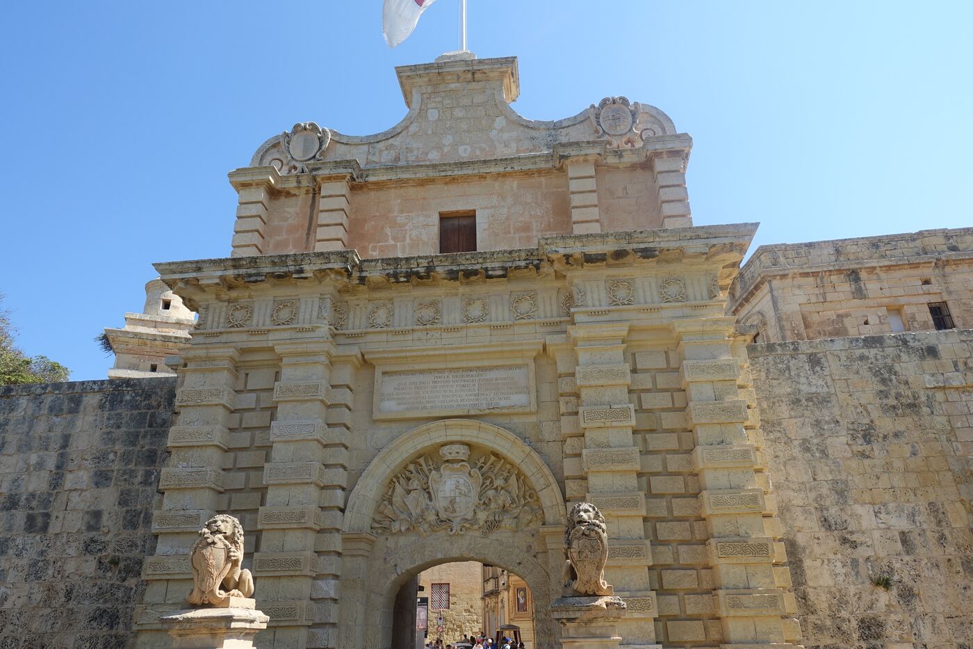 The main gate of Mdina, with the bastion wall either side of it.